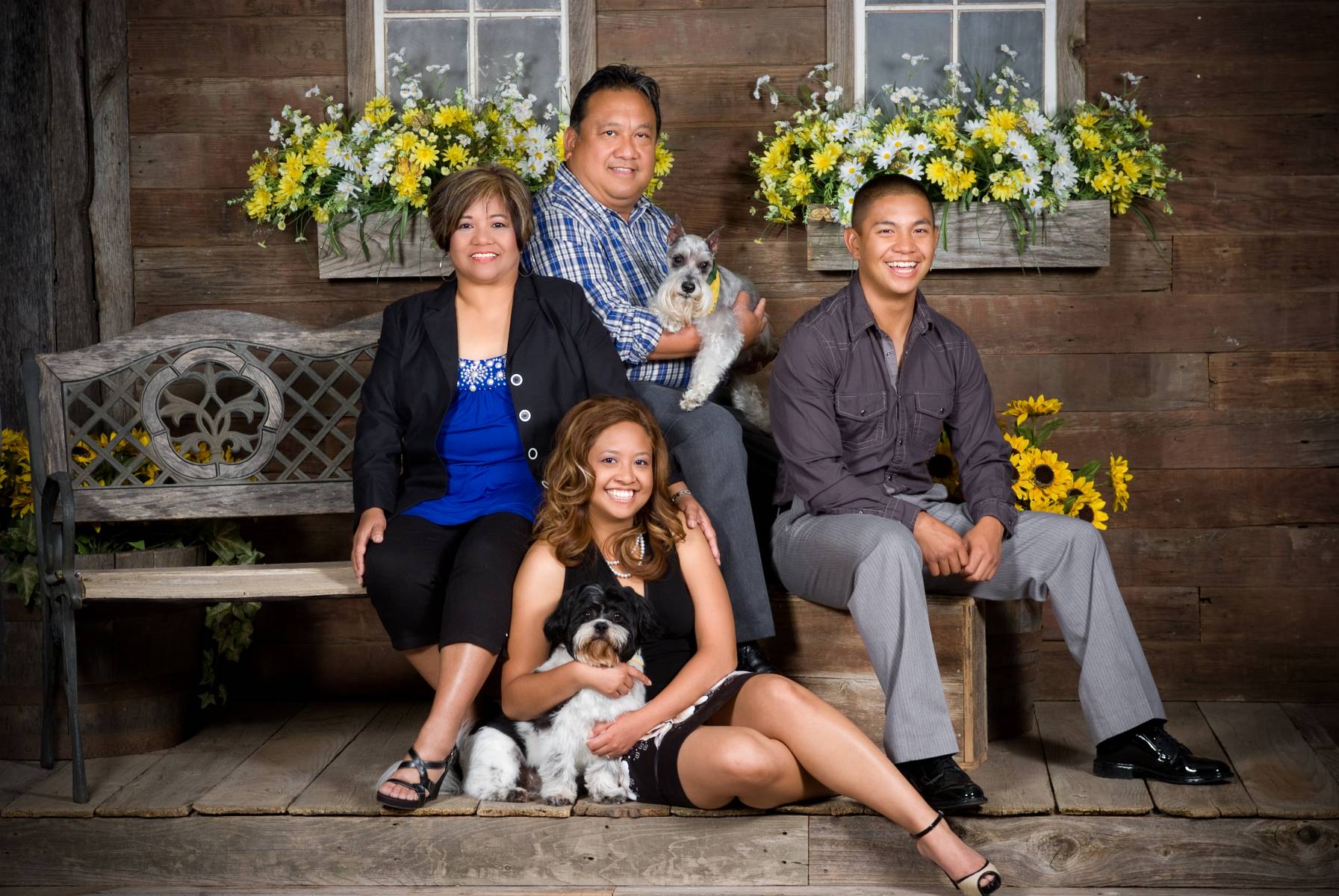 The Lim family photographed on a country porch located in Robertsons' Warehouse Photography, Wichita, KS