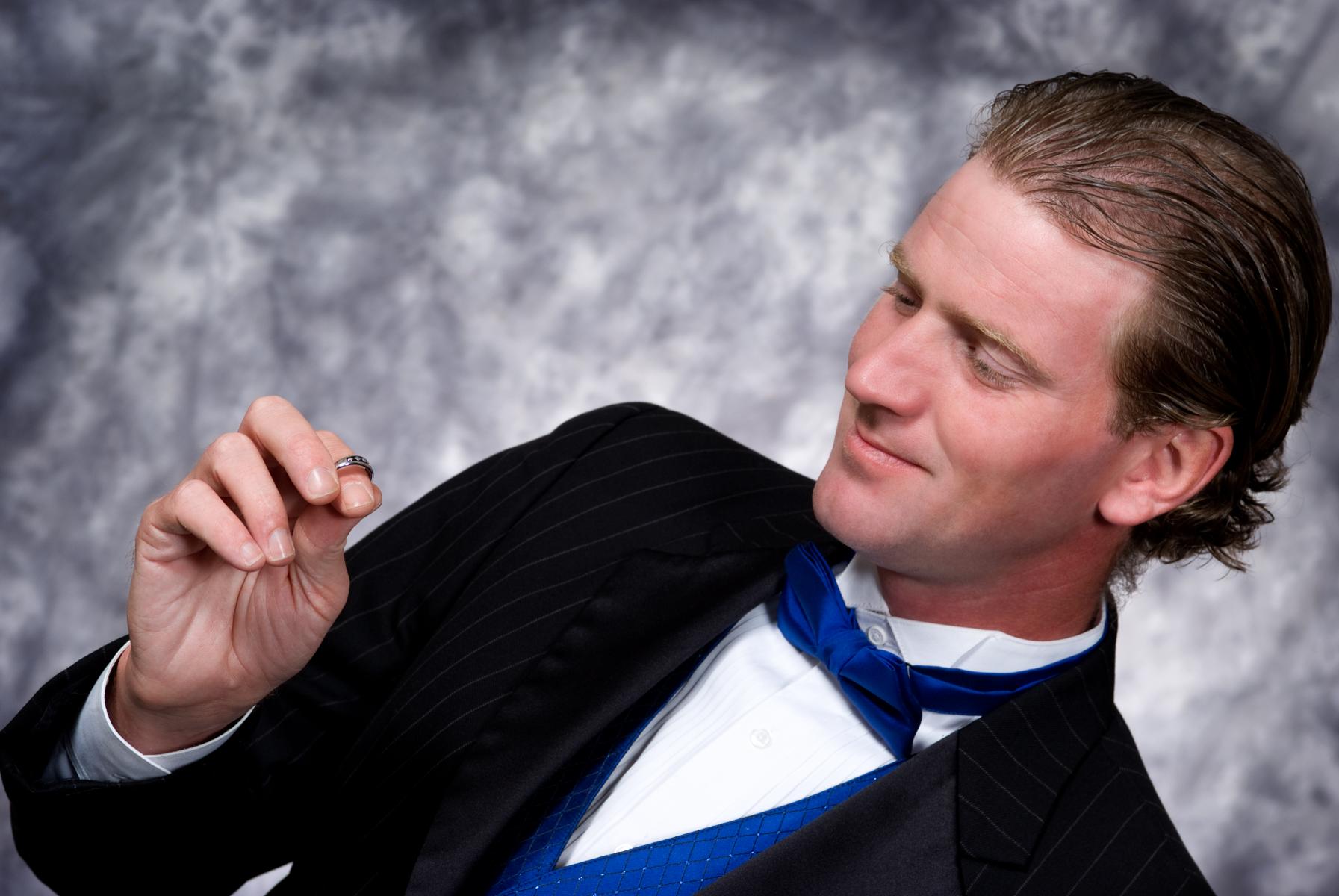 Reflecting on the memories that led him to fall in love with his bride, by Robertsons' Warehouse Photography, Wichita, KS